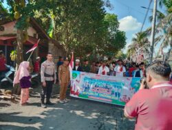 Bhabinkamtibmas Desa Tibusisok Polsek Janapria Kawal Karnaval Meriah di Janapria