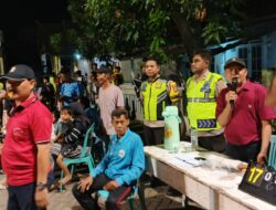 BHABINKAMTIBMAS MENALA AMANKAN PERTANDINGAN BOLA VOLI DI LAPANGAN GOTONG ROYONG